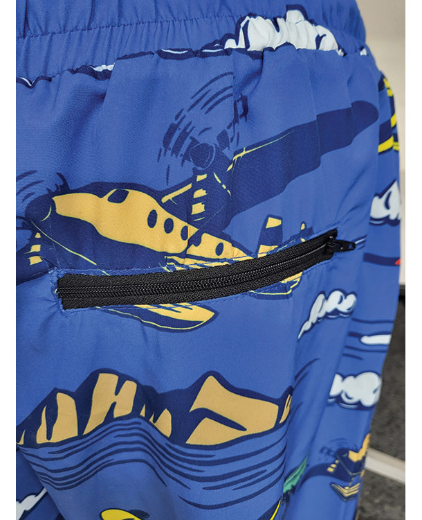 blue aviation themed swimming trunks pocket zipper close up